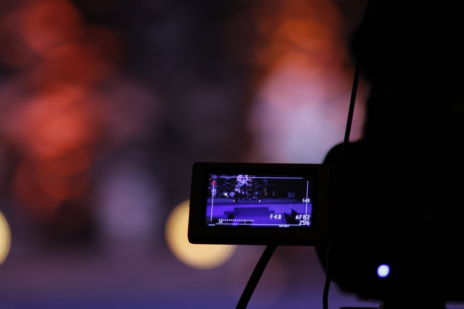 Close-up of a digital camera screen recording a scene with a vibrant bokeh background. — NBA Broadcast: Watch every game live